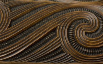 Example of whakairo surface design with haehae/carved parallel ridges and pakati/notching. This is a detail of a waka huia/treasure box carved by Te Rangikapiki Fraser.