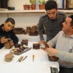 Woodcarver A.Azlarov with his apprentices. 2012